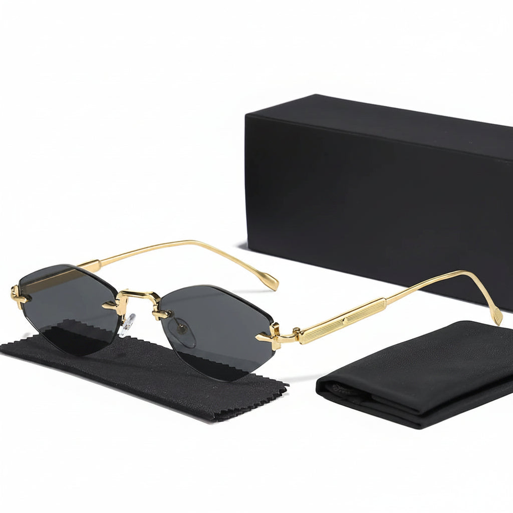 Gold-framed sunglasses with black lenses on a white background, featuring Caterside branding.