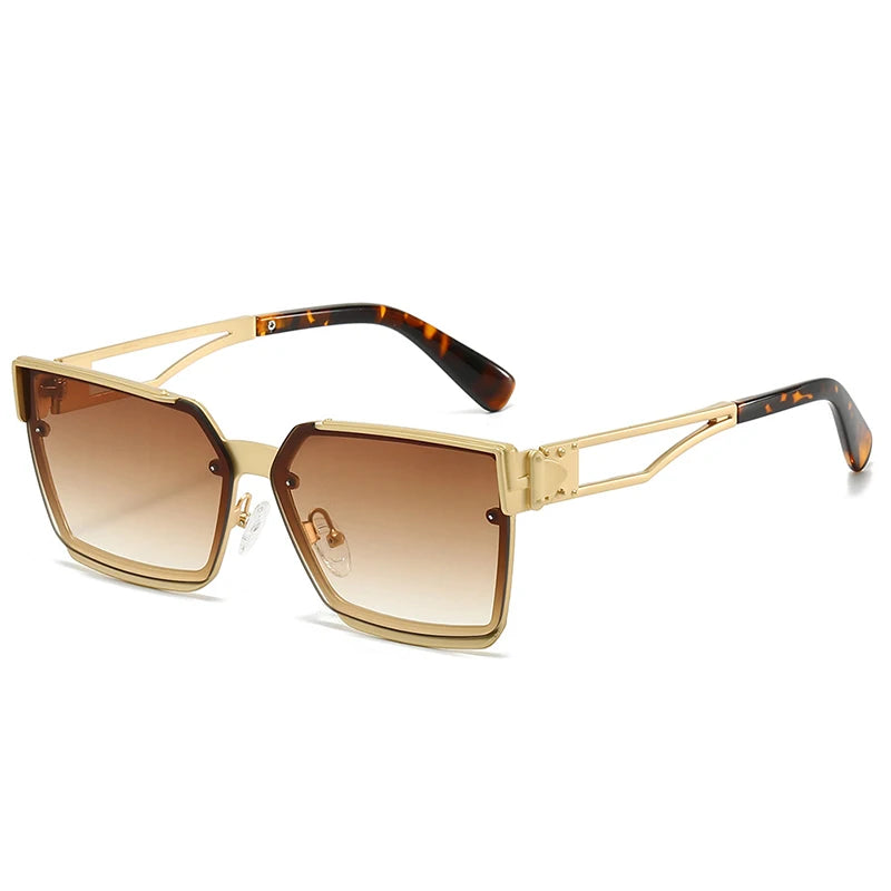 Gold-framed sunglasses with brown gradient lenses on a white background