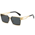 Gold-framed sunglasses with black lenses on a white background