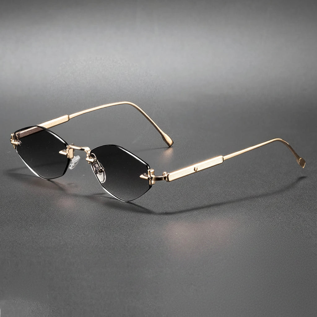 Gold-framed sunglasses with black lenses on a gray background, featuring the Caterside brand.