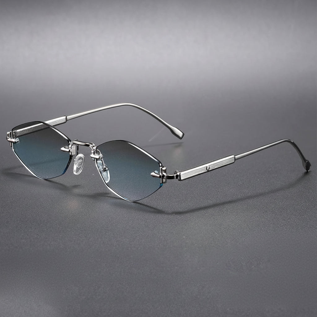 Silver rimless eyeglasses on a gray background with 'Caterside' branding.