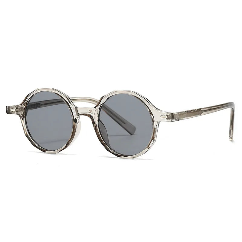 Round sunglasses with transparent frame and dark lenses on a white background