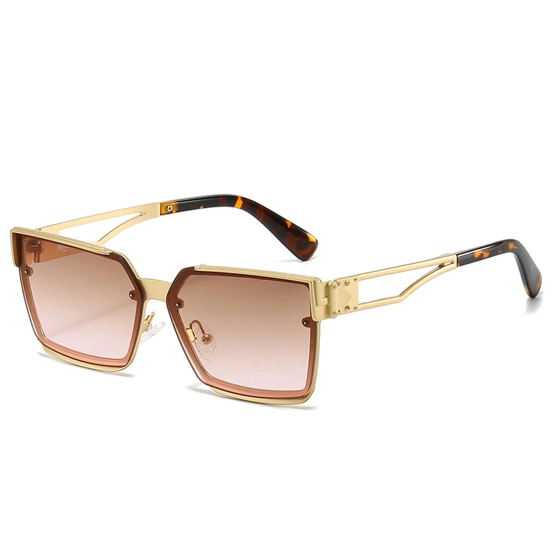 Gold-framed sunglasses with brown gradient lenses on a white background